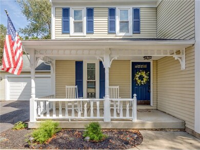 The adorable front porch welcomes you into the hom