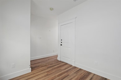 Spare room with wood-type flooring