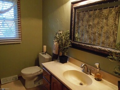 The full bath in the hall is modern, clean and spa