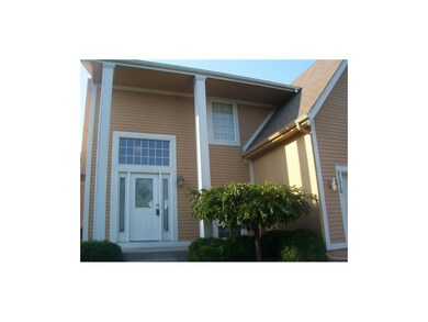 Close-up of front entry and covered porch.