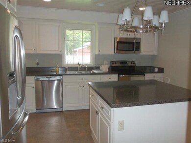 Beautifully updated kitchen with custom cabinets, 