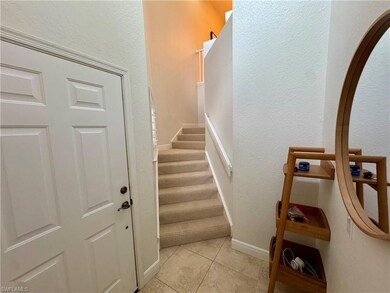 Staircase featuring a textured wall, tile patterne