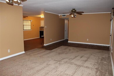 LIVING ROOM HAS BRICK ENTRY
