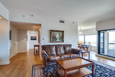 The open living room has a wall of windows leading