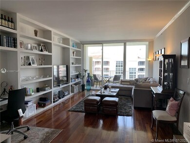 Living room with built-in shelves and desk area