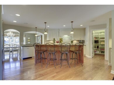 The gourmet kitchen features this large center isl