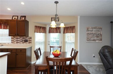 The kitchen includes a breakfast area with a bay w