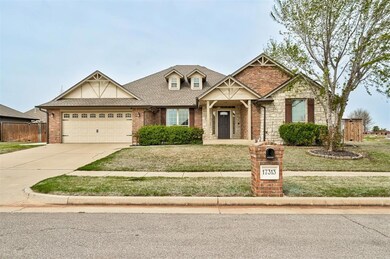 View of front of home featuring fence, an attached