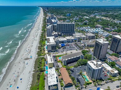 Drone / aerial view with a beach view and a water 