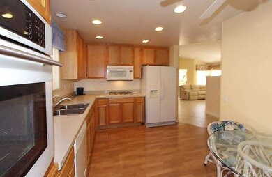 Kitchen with laminate flooring, granite countertop