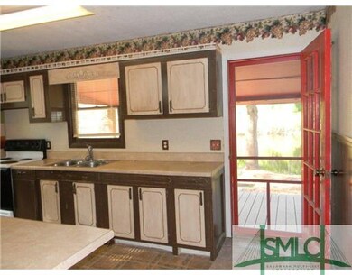 Kitchen. With screen door to back deck.