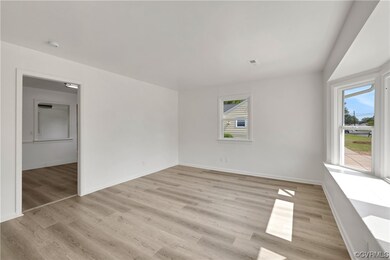 Unfurnished room featuring light hardwood flooring