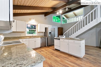 Entry door is shown at bottom of stairs