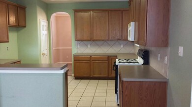 Kitchen with gas range.