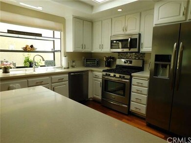 Another picture of kitchen showing breakfast count