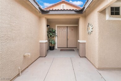Property entrance featuring stucco siding and a ti