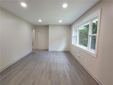Unfurnished room with recessed lighting and light wood-style flooring