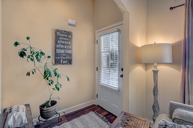 Wood Laminate flooring in this spacious entryway, leading on to the Great Room