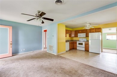 Kitchen with light carpet, brown cabinets, ceiling