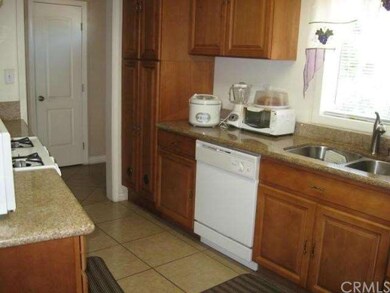 KITCHEN WITH GRANITE COUNTER TOPS AND NEW CABINETS