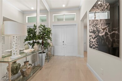 Entryway featuring elegant furnishings, custom flo