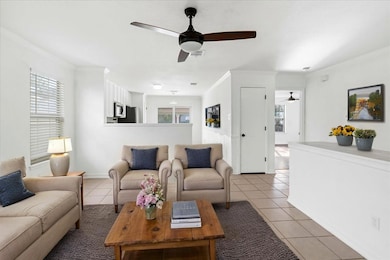 Tiled living area with ornamental molding and a c