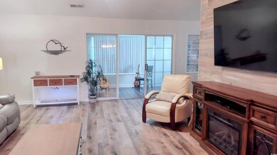 Sitting room featuring light wood-style flooring