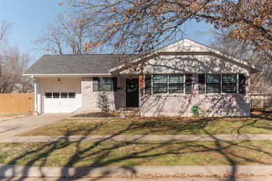Ranch-style house with a front lawn and a garage