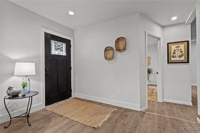 Entrance foyer featuring light wood-type flooring