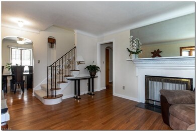 Spacious Living Room with Hardwood Floors and Bay 
