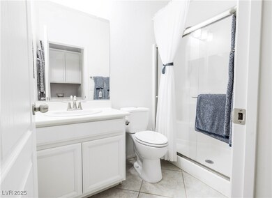 Downstairs FULL Bathroom with tile patterned floor