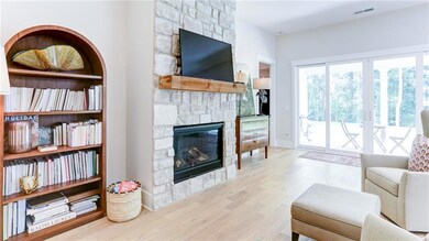 Family Room has 4 panel windows and doors allowing abundant natural lighting
