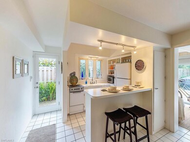 Cute kitchen with lots of light and open shelves!