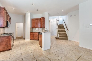 Kitchen featuring light tile patterned flooring, b