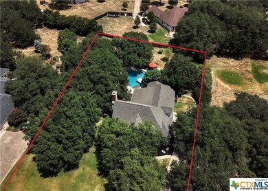 This elegant home sits on just over 1 acre of land.