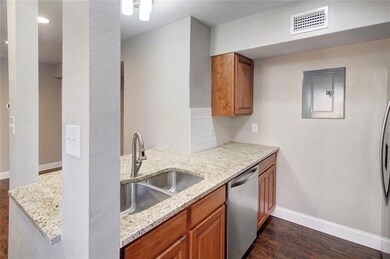 KITCHEN WITH GRANITE COUNTER TOPS