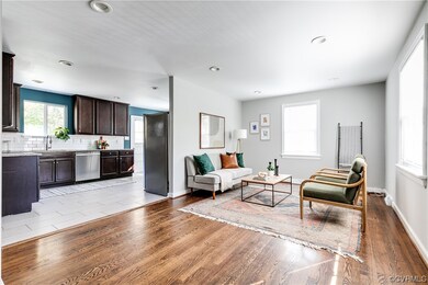 Living room featuring wood flooring and recessed l