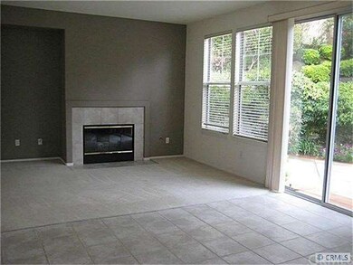 Family room with fireplace opens onto enclosed bac