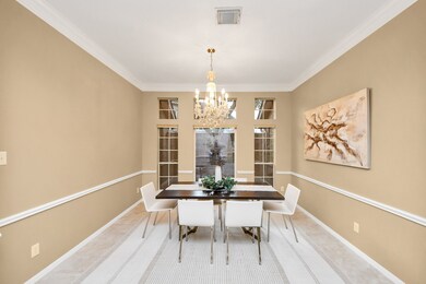 This elegant formal dining space is filled with na