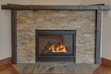 Gas Fireplace with ledge stone and custom ironwork