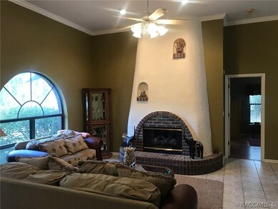 Living room with wood burning fireplace to Master