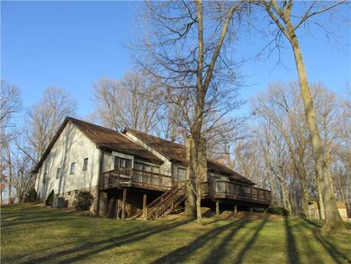 Exterior Back. Large rear deck spanning the length