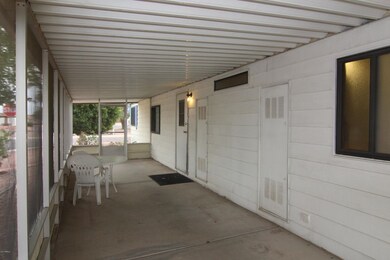 PATIO ALMOST FULL LENGTH OF HOUSE