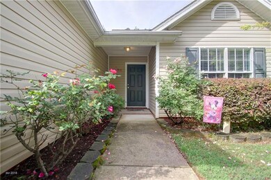 FRONT PORCH: Superb curb appeal created by mature 