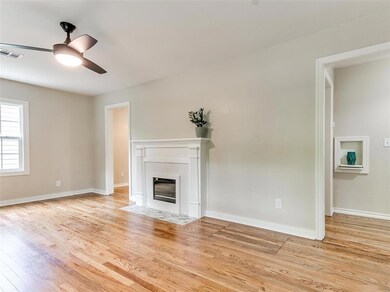 Unfurnished living room featuring light hardwood /