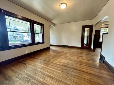 Unfurnished room featuring hardwood / wood-style floors