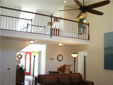 Atrium ceilings open to catwalk above - this home 