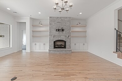 Stone to ceiling on fireplace, built ins, and floa