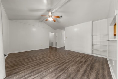 Empty room with dark wood finished floors and ceil