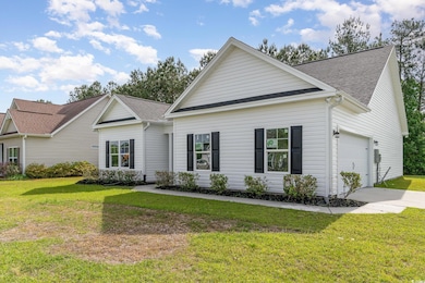 View of front of house with a shingled roof, drive